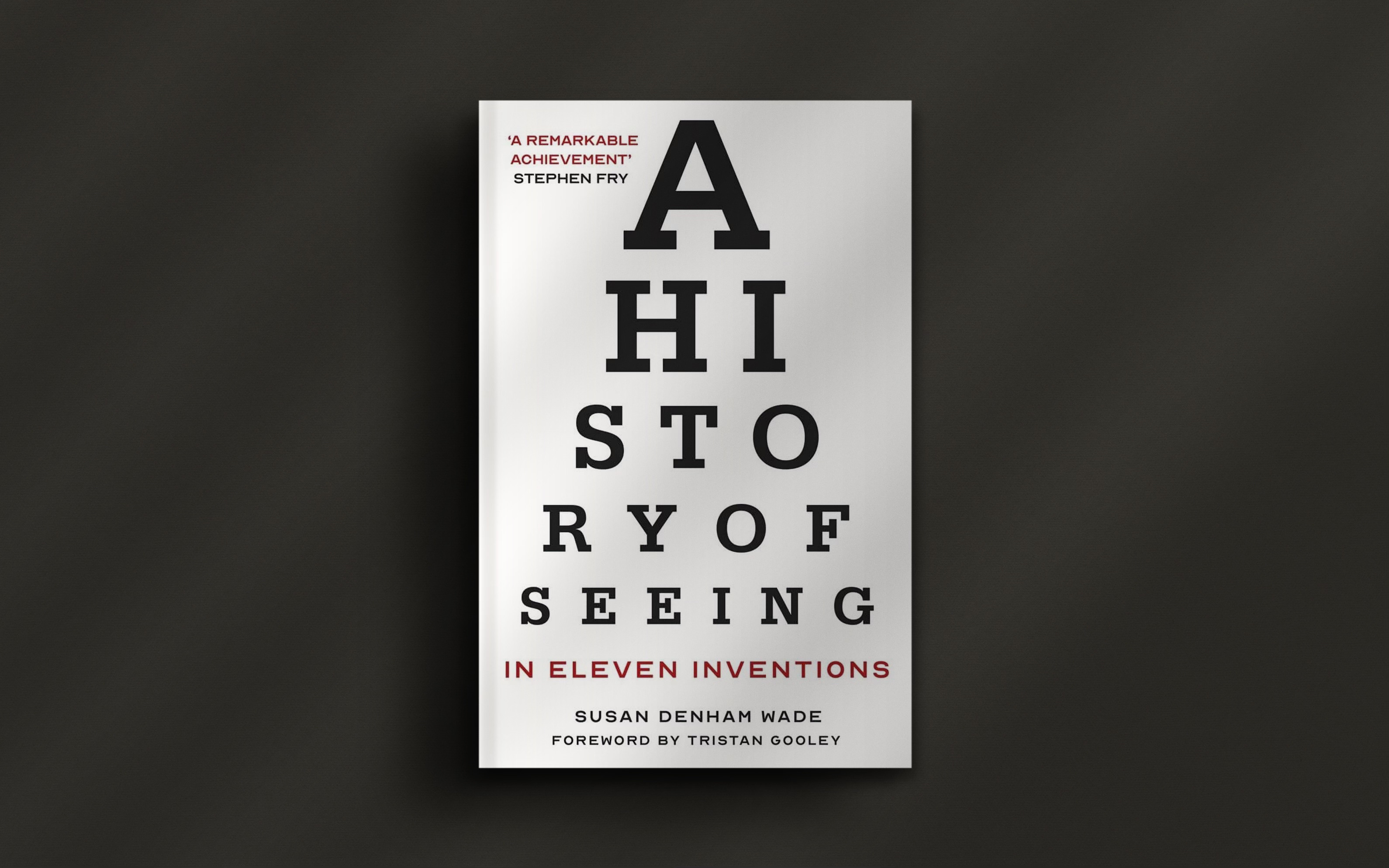 Book cover titled "A History of Seeing in Eleven Inventions" by Susan Denham Wade, with a foreword by Tristan Gooley. Text design resembles an eye chart.